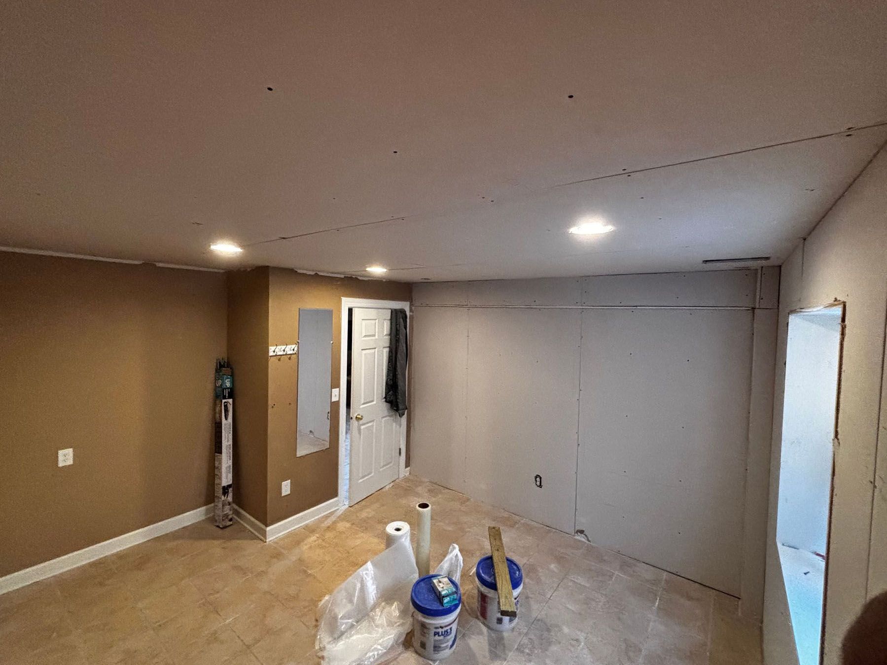 A room with a ceiling that is being remodeled.