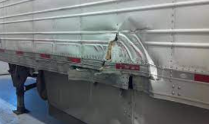damaged side of a trailer truck