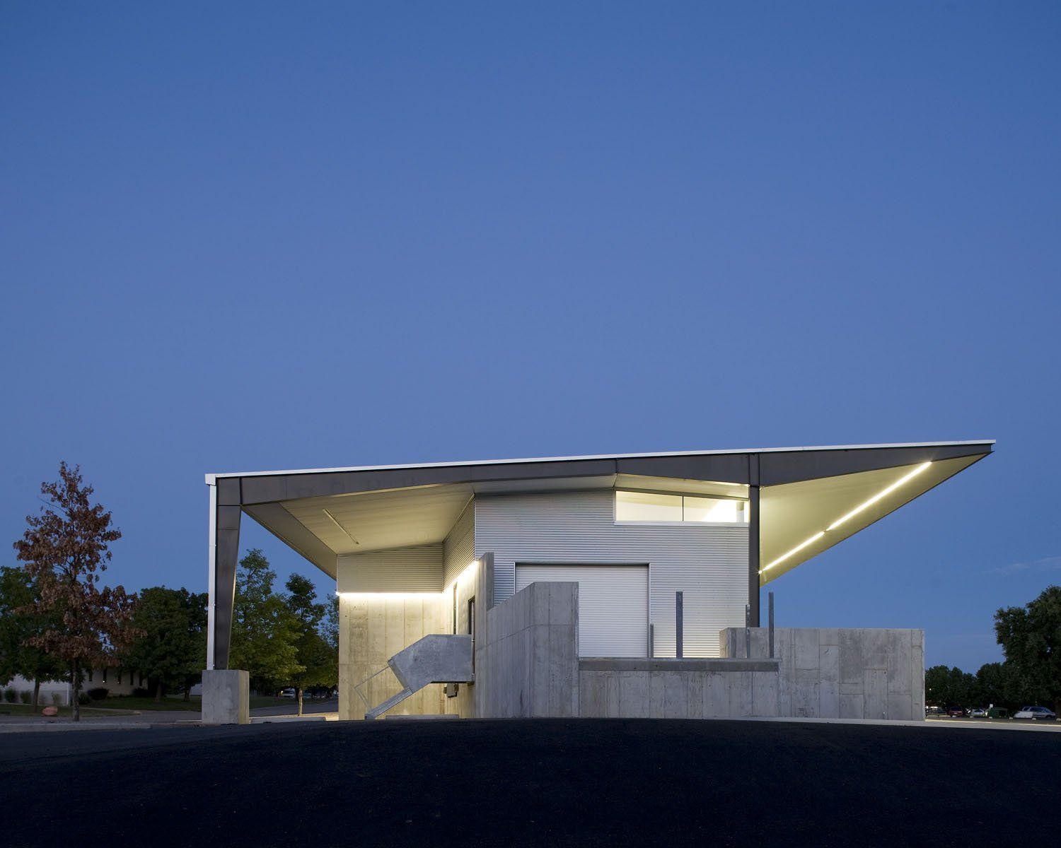 A white building with a roof that has a canopy over it