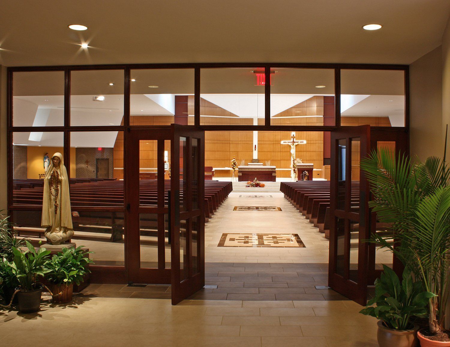 The inside of a church with the doors open