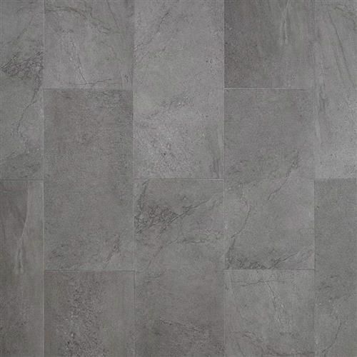 A close up of a gray tile floor.