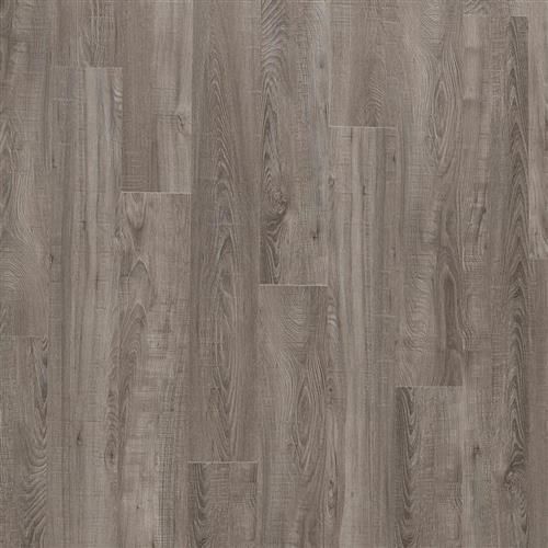 A close up of a gray vinyl floor that looks like wood.