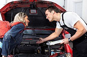 Mechanic assisting a customer