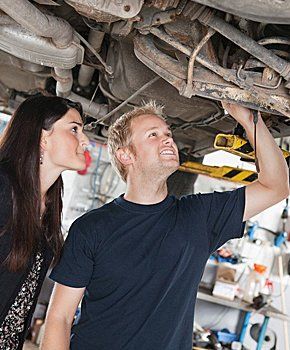 Mechanic helping customer