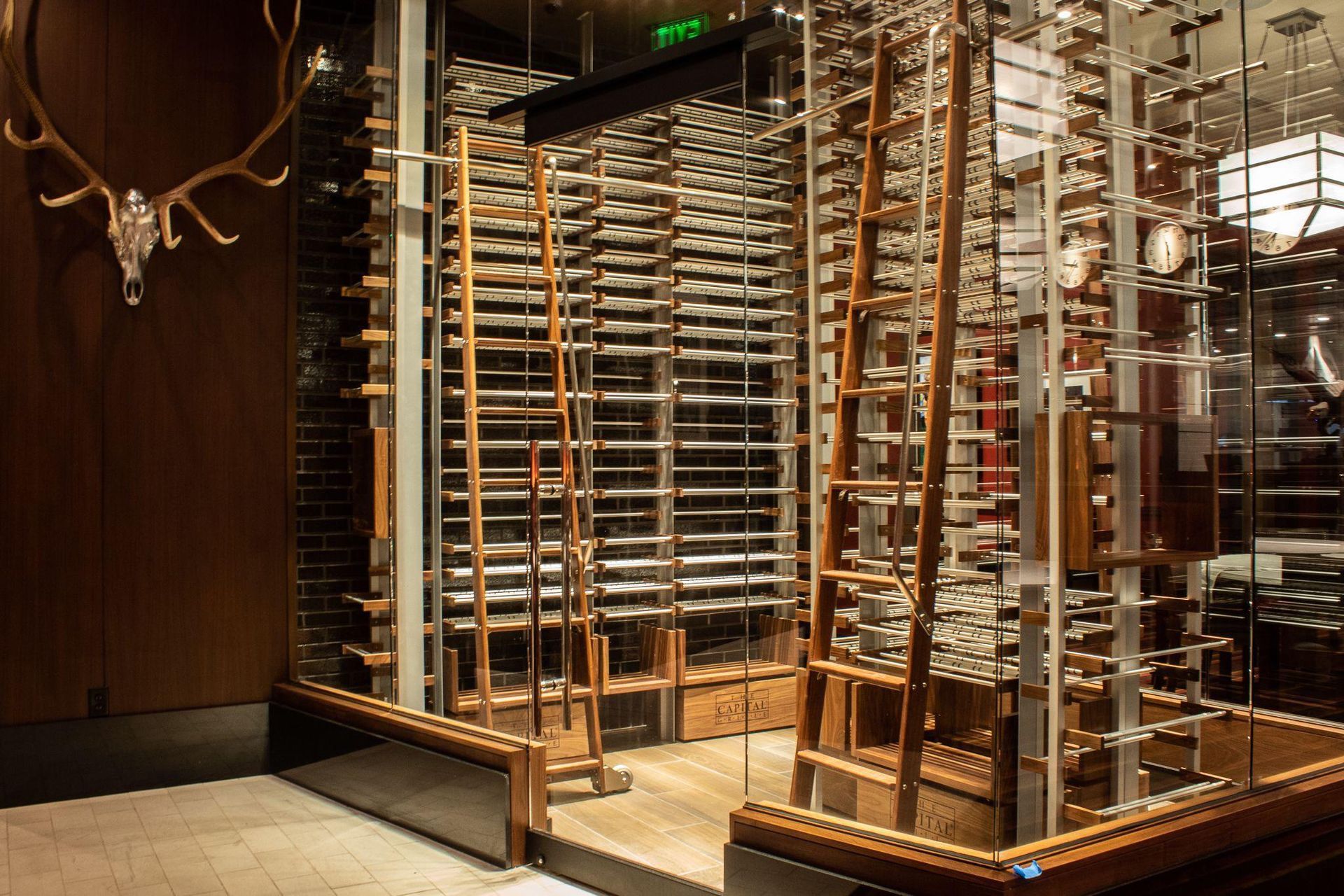 Glass-and-wood revolving door entrance with metal framework in a lobby