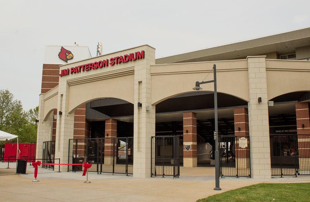 M&T Bank Stadium entrance with arched brick facade and red signage under an overcast sky