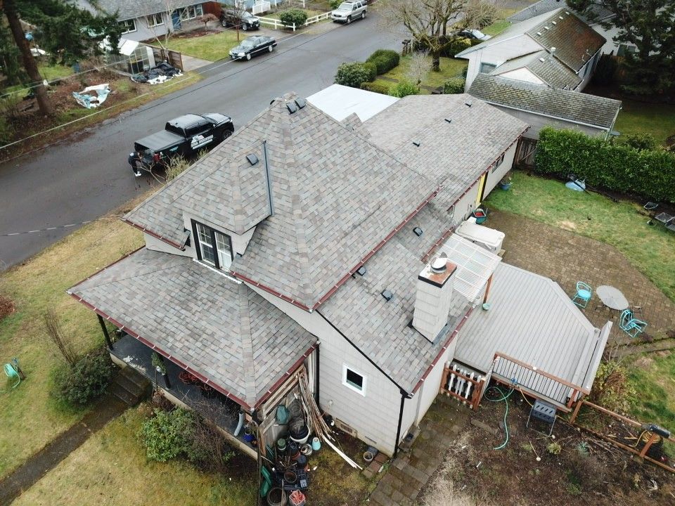 An aerial view of a house with a roof