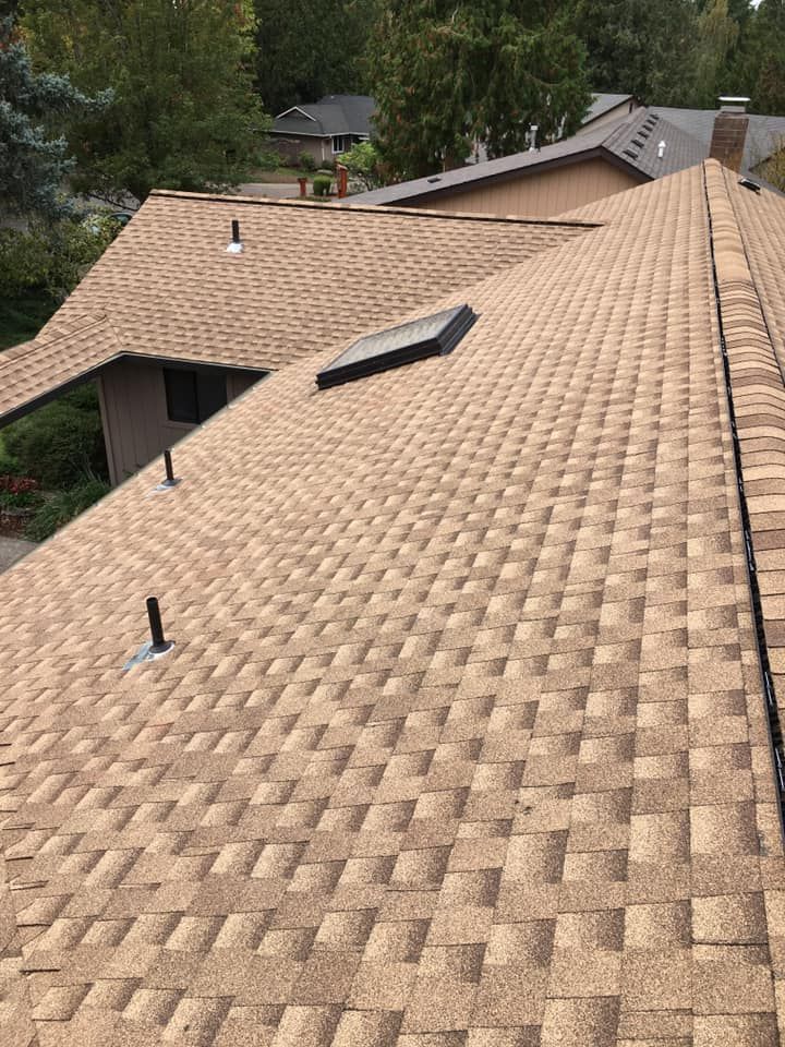 A close up of a roof with a skylight on it.