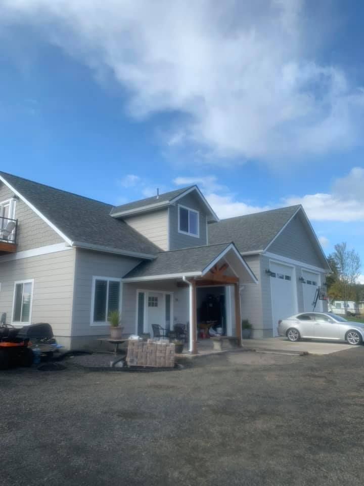A large house with a car parked in front of it.