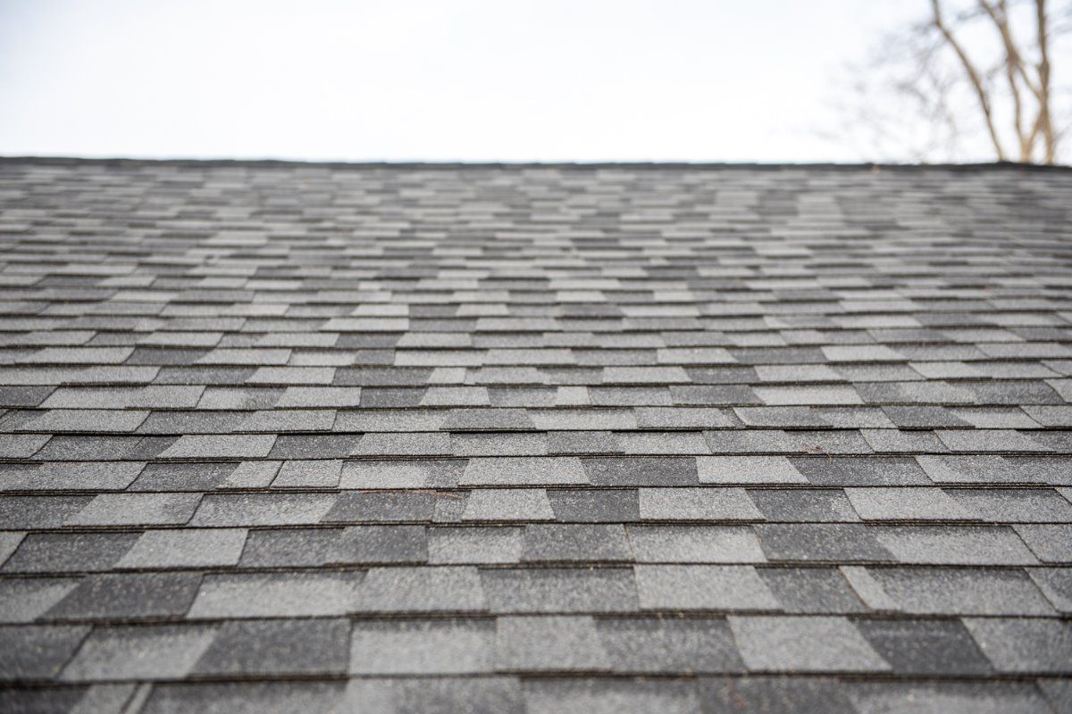 A close up of a roof with shingles on it.