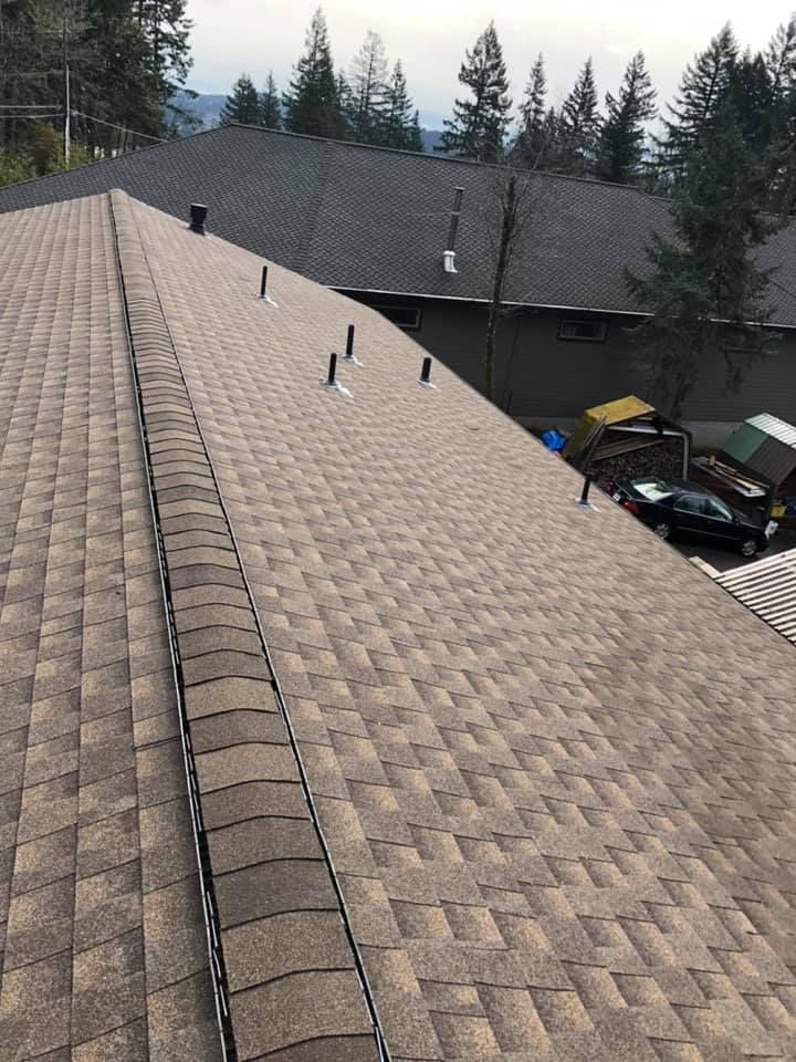 The roof of a house with a lot of tiles on it.