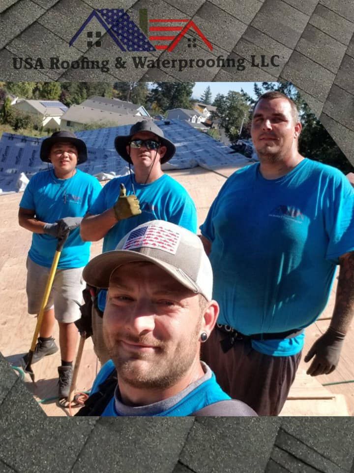 A group of men are standing next to each other in front of a roof.
