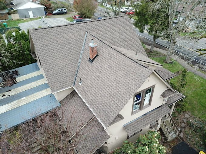 An aerial view of a house with a chimney on the roof.