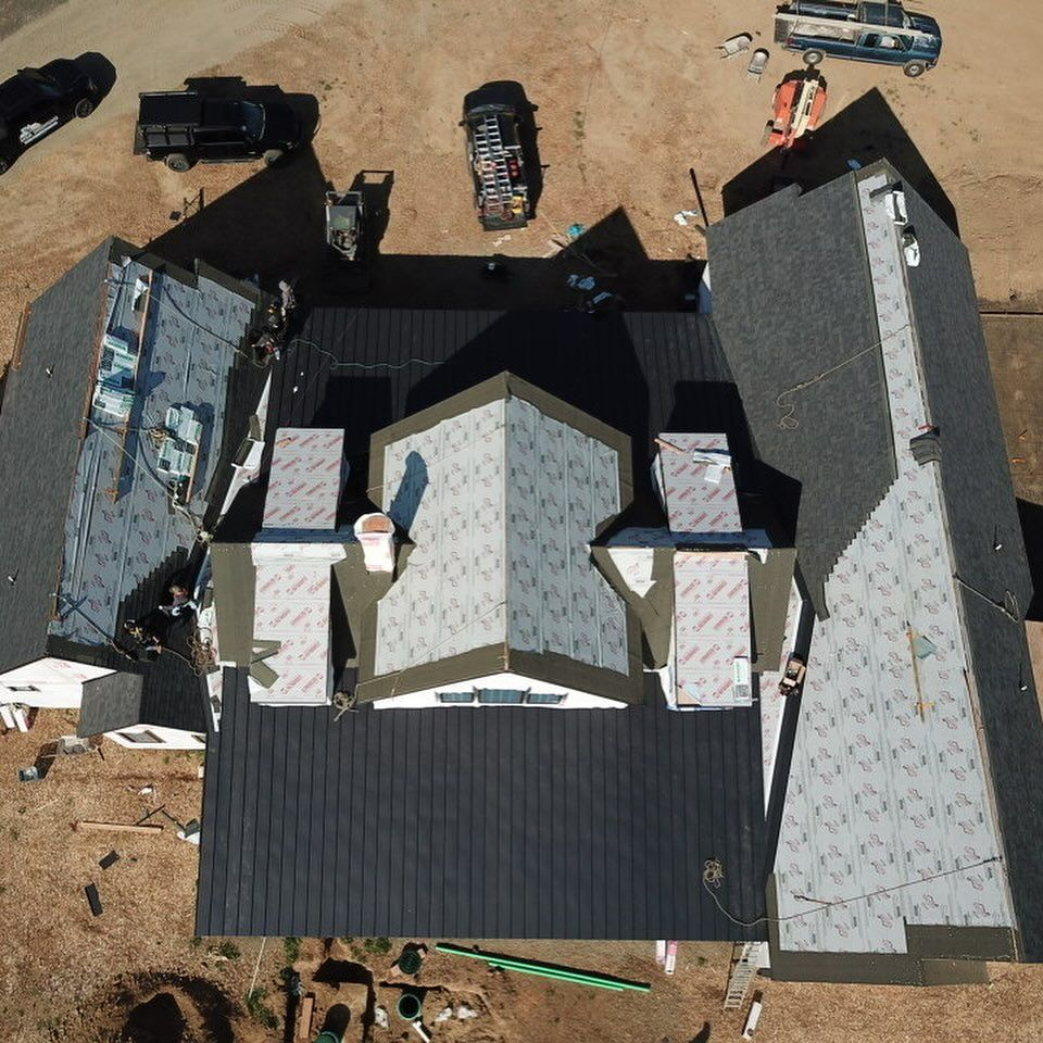 An aerial view of a large house under construction.