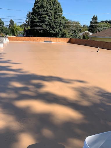 A roof with a shadow of a tree on it.