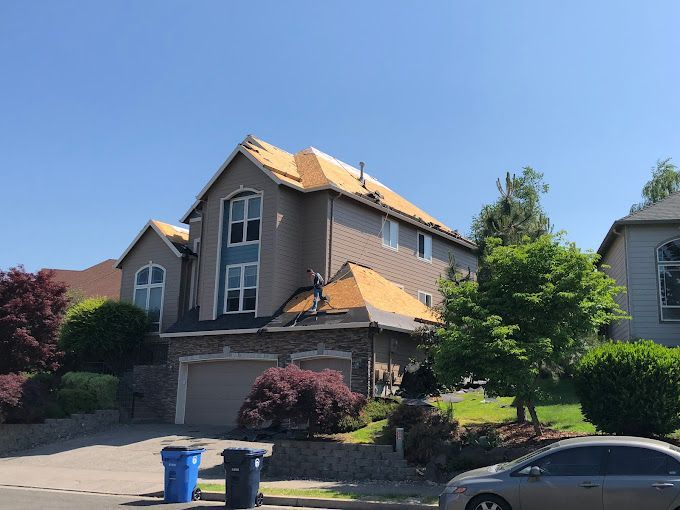 A large house with a car parked in front of it.
