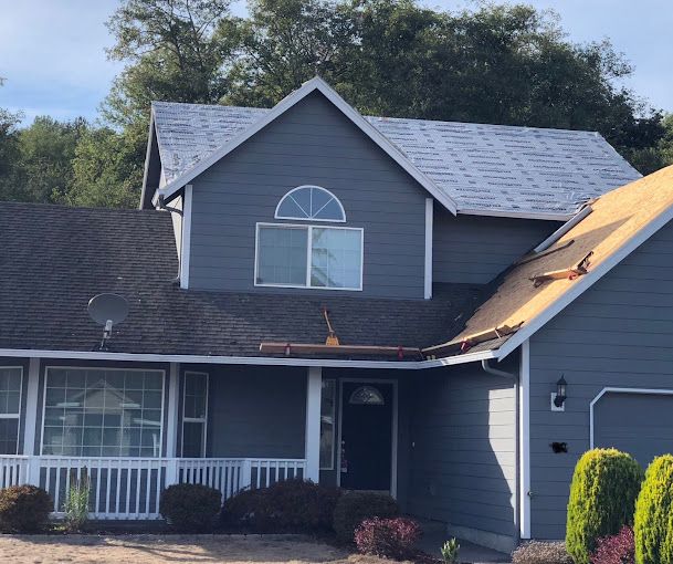 A house with a roof that is being repaired.