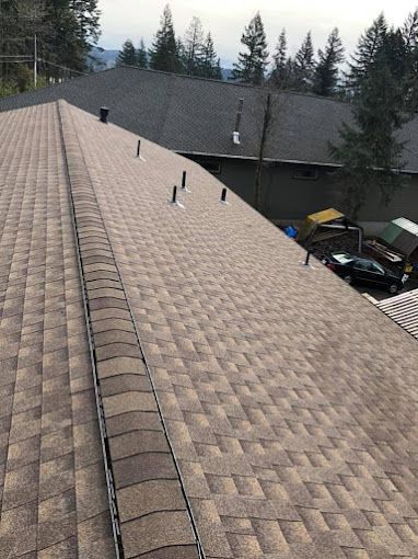 The roof of a house with a lot of shingles on it.