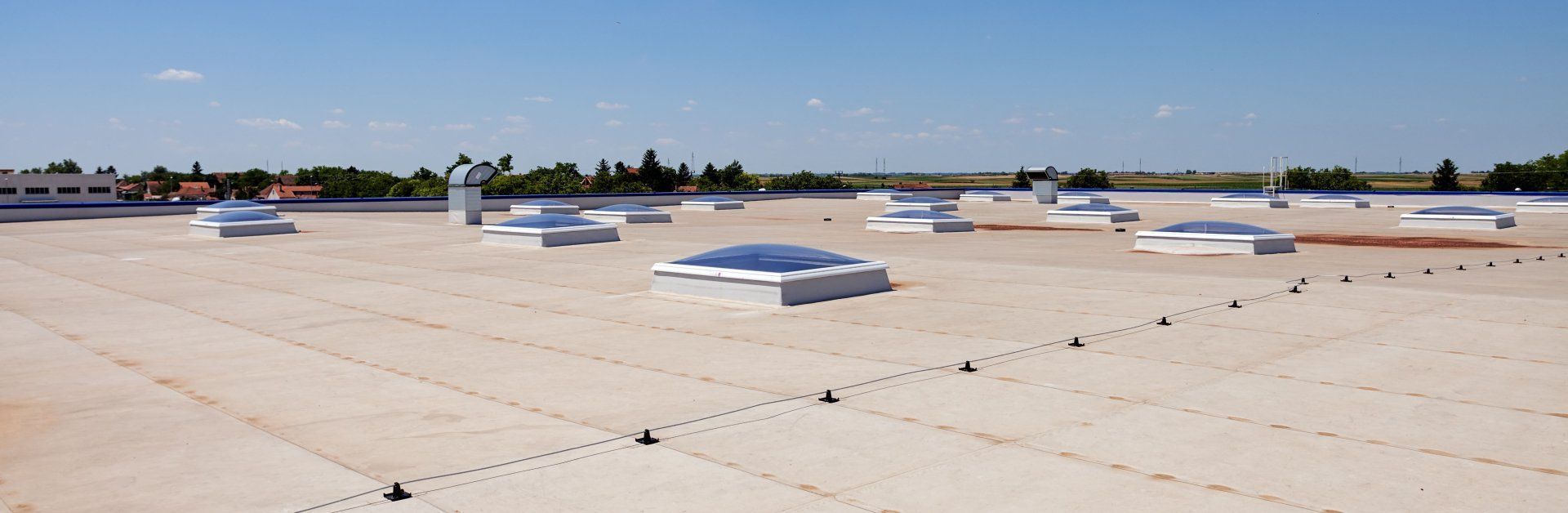 A roof with a lot of skylights on it.