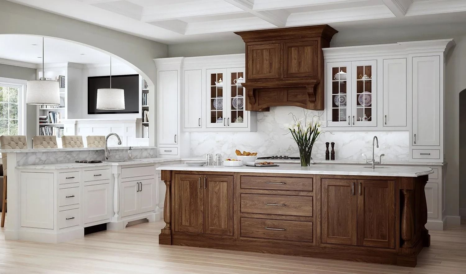 Bright modern kitchen with white cabinets, marble counters, and a large dark wood island