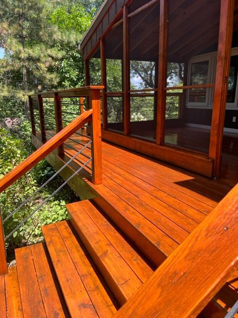 A wooden deck with stairs leading up to it.