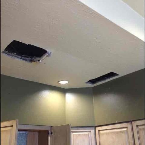 there is a hole in the ceiling in a kitchen