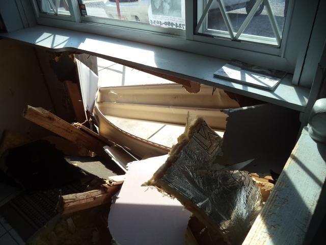 a broken window sill in a room
