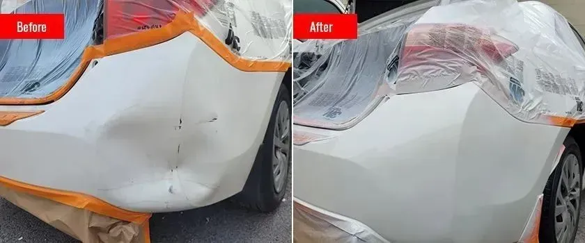 Side-by-side close-up of a white car bumper dent before and after repair with orange tape around it
