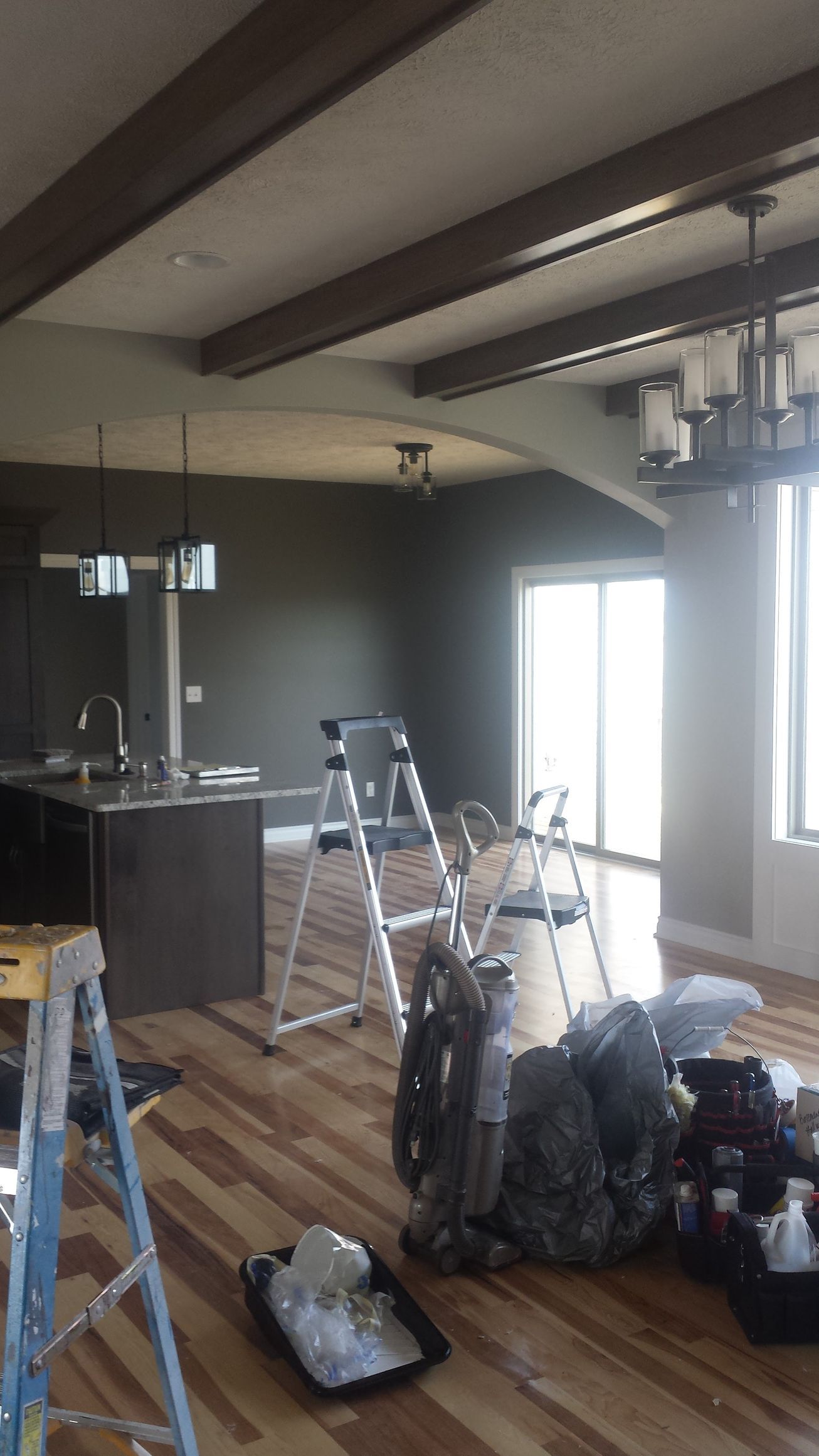 a gray painted wall with white trim