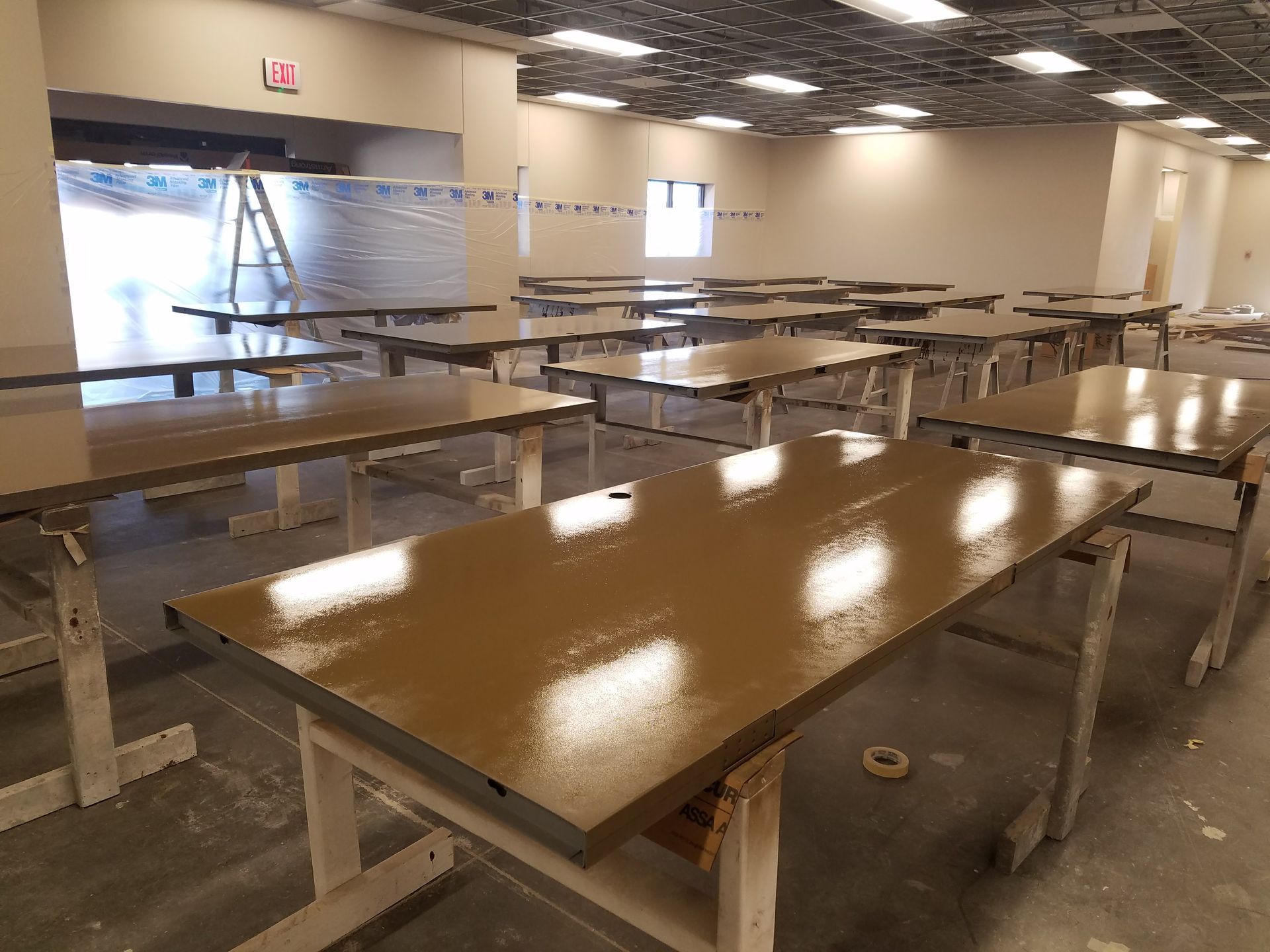 A large room filled with tables and chairs.