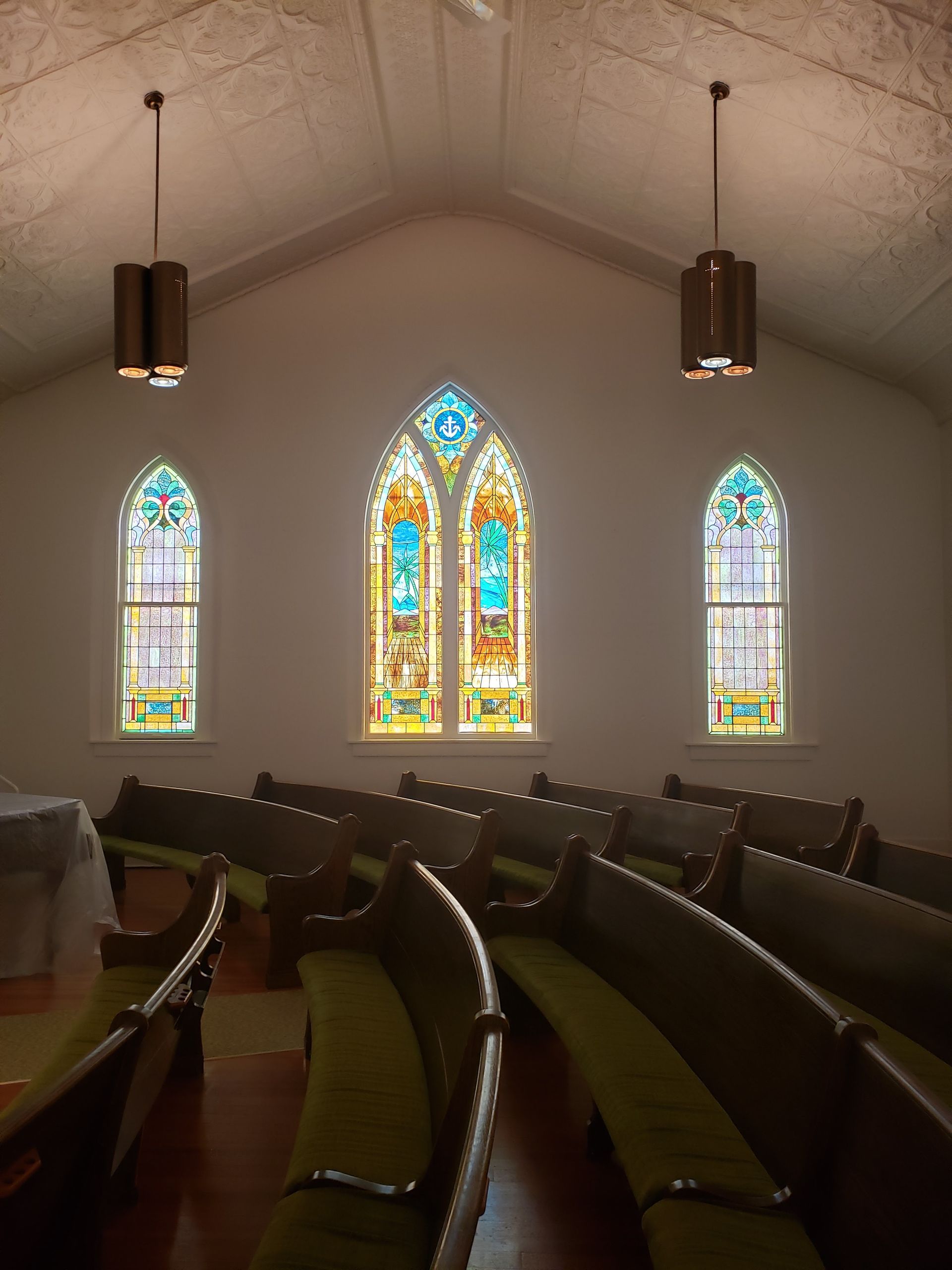 The inside of a church with stained glass windows