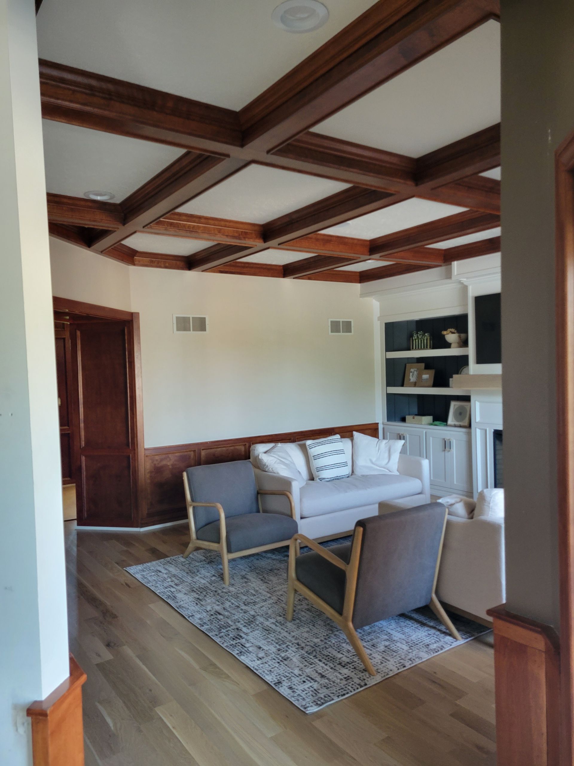 A living room with a couch and chairs in it