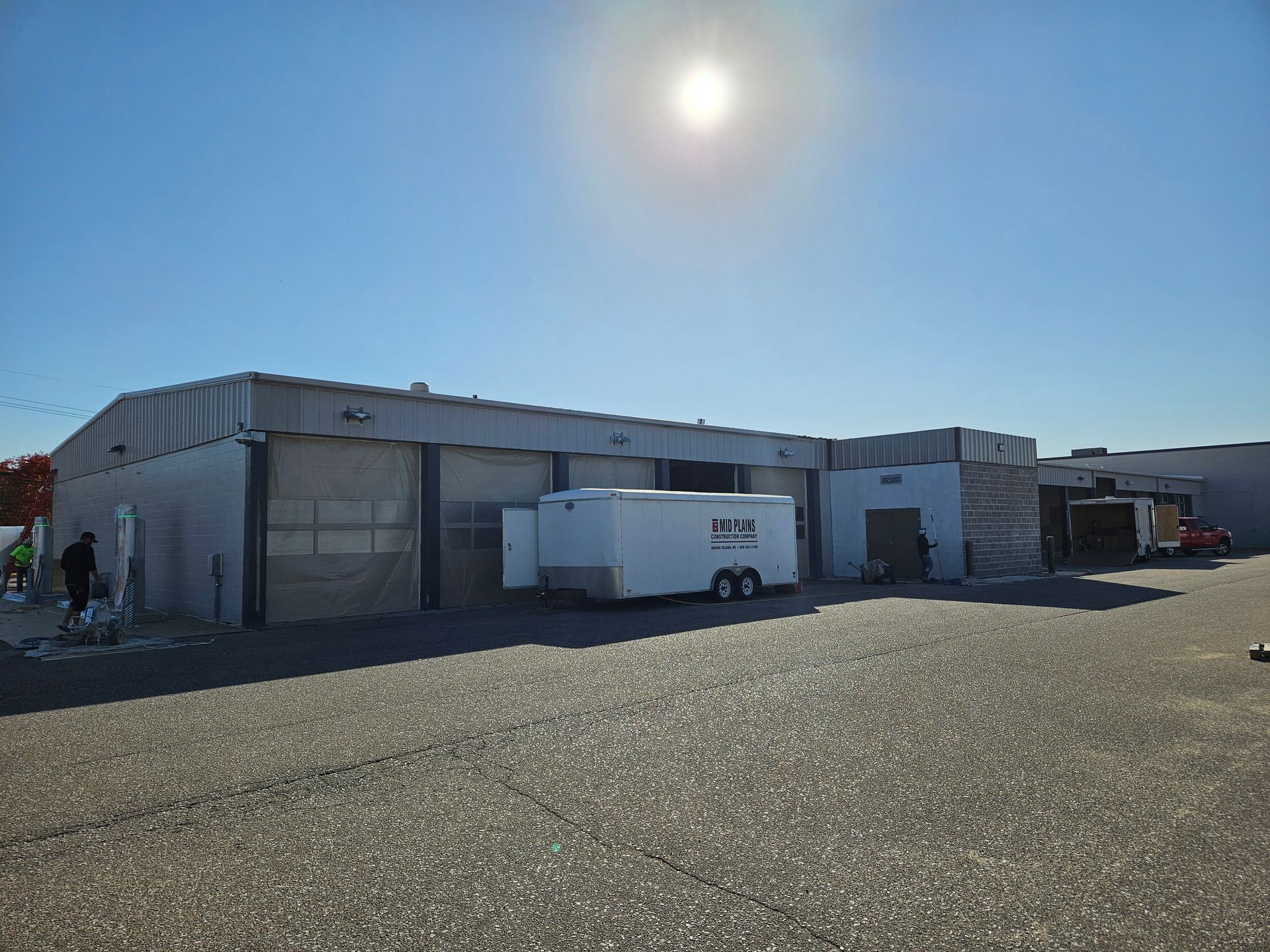 A large building with a trailer parked in front of it.