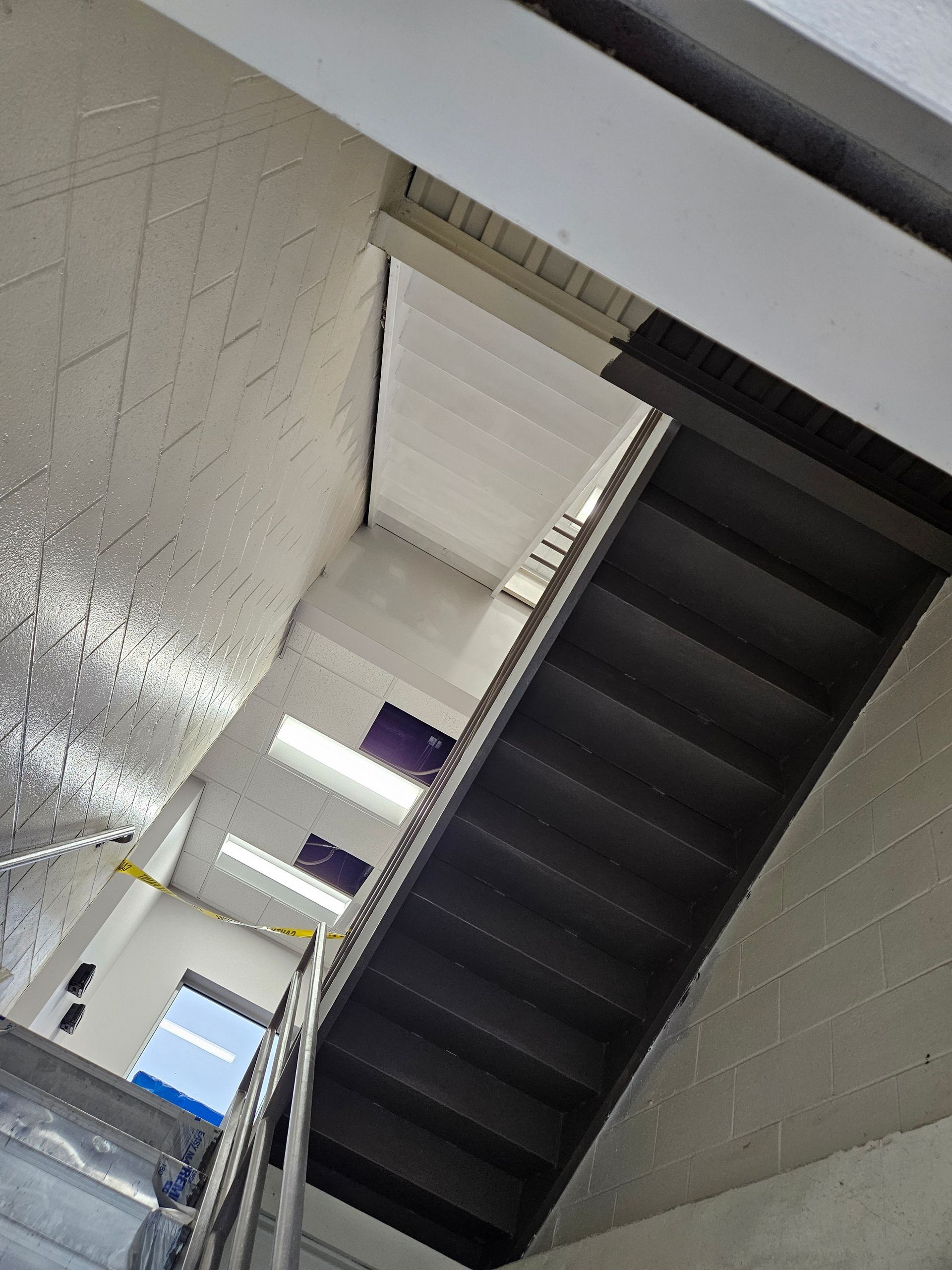 Looking up at a staircase in a building.