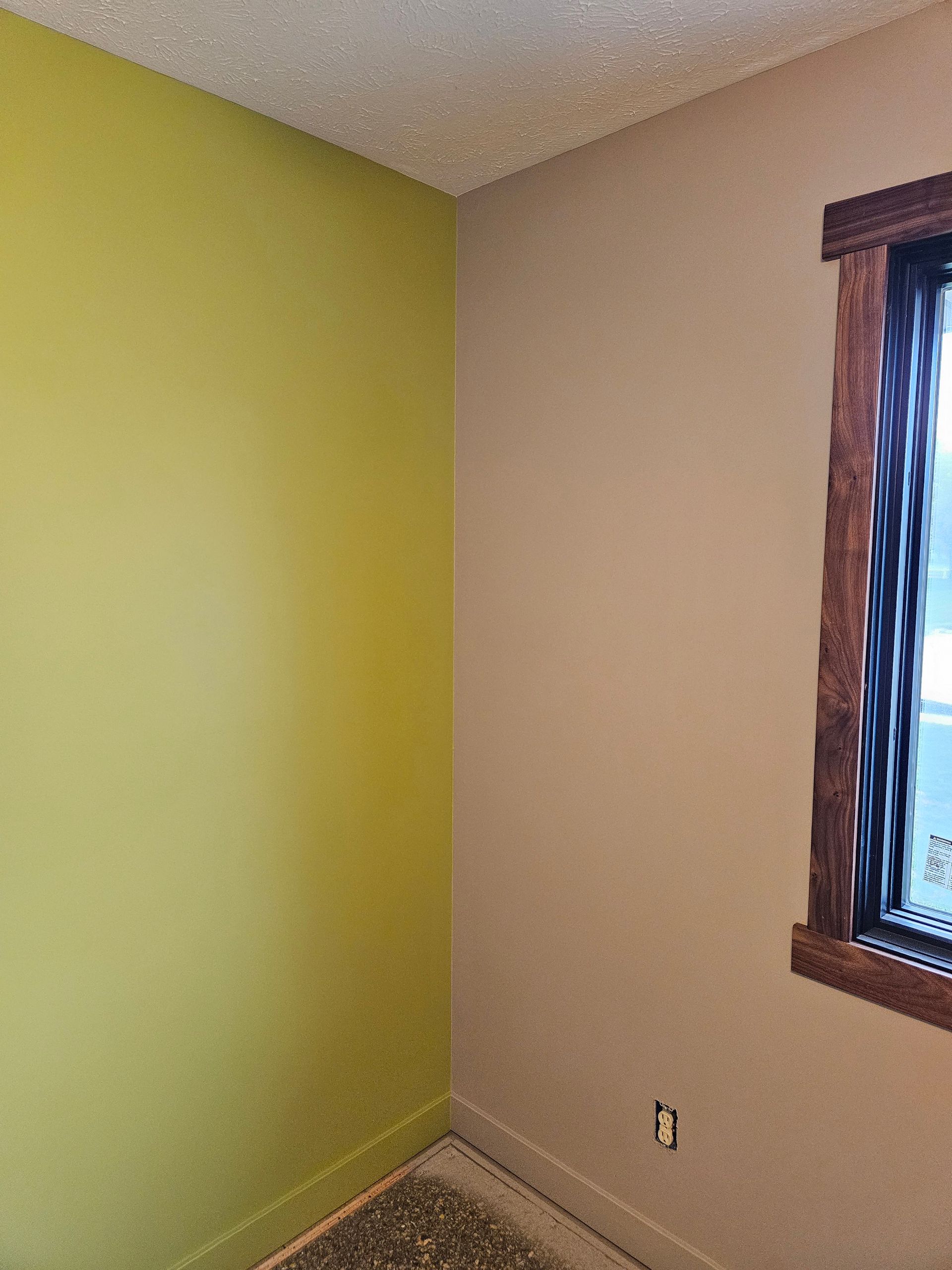 There is a window in the corner of the room.