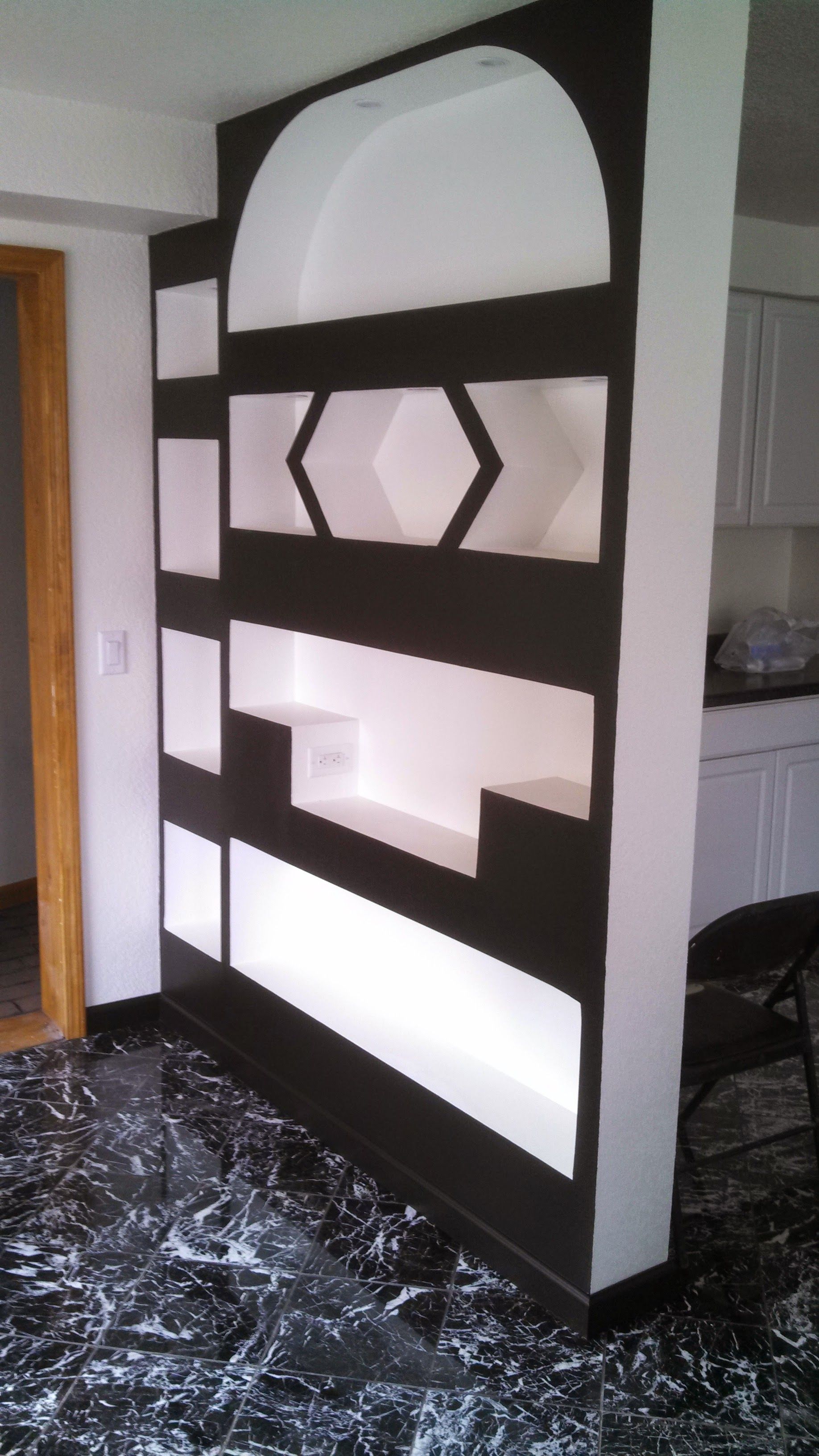 A room divider with a black and white design on it