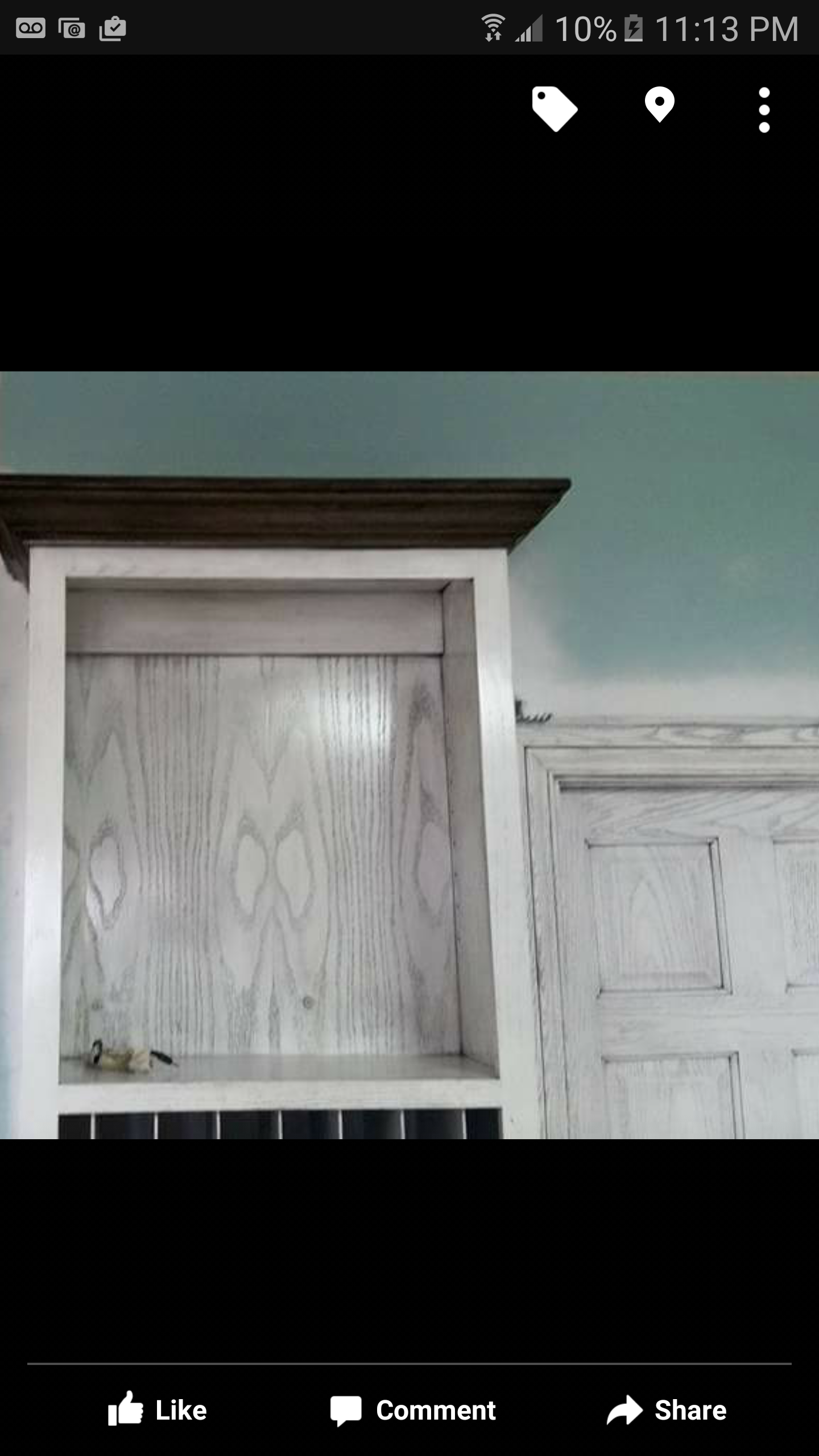 A picture of a shelf on a phone screen