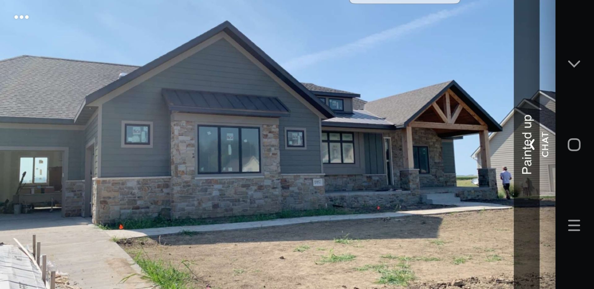 A picture of a house that is being built on a tablet.