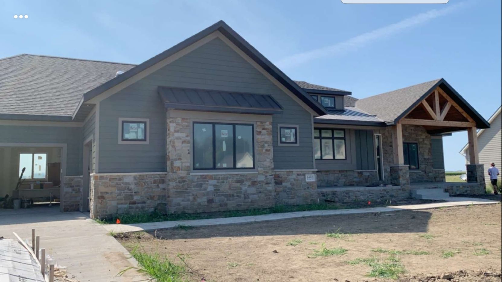 A room with a bench and shelves in it.