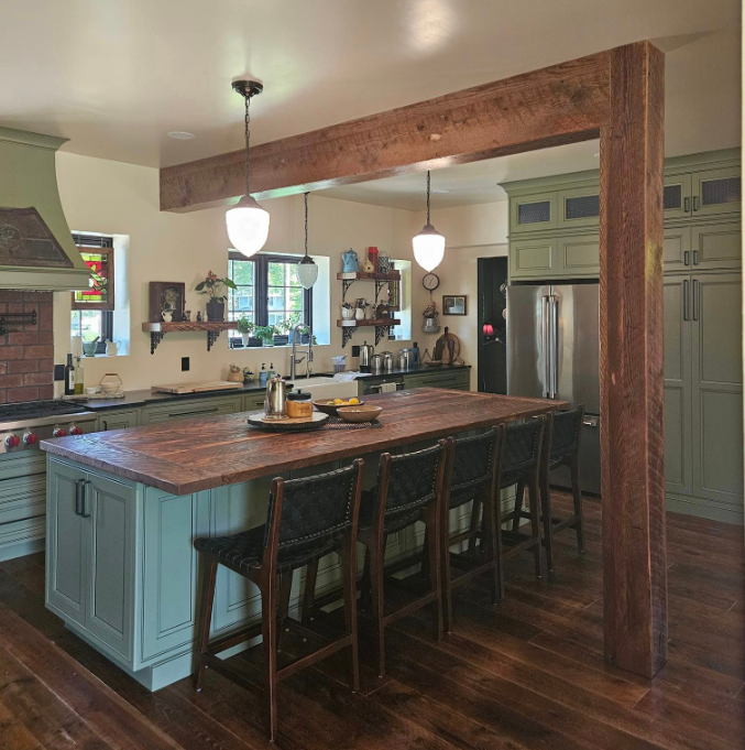 A large white building with a gutter on the side of it.