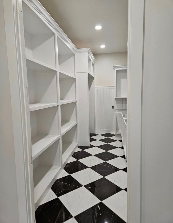 A room with a vaulted ceiling and blue walls.