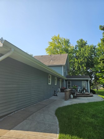 A house with a walkway leading to the backyard