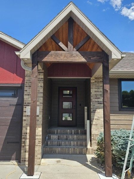 The front of a house with a porch and stairs