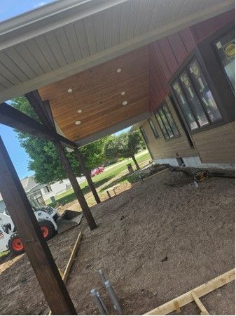 A house is being built with a covered porch.