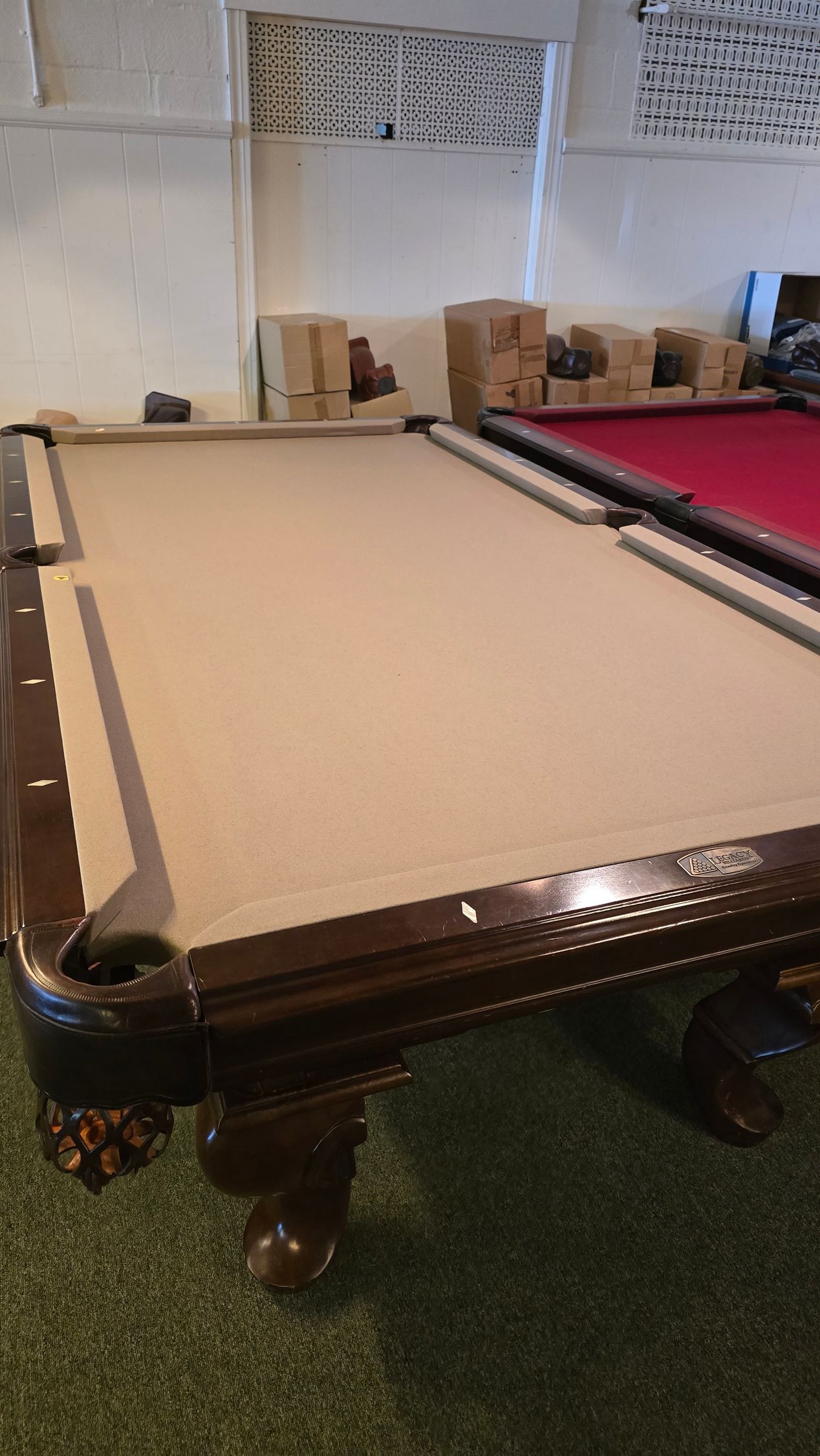 Two long metal blades resting diagonally on a table in a living room.