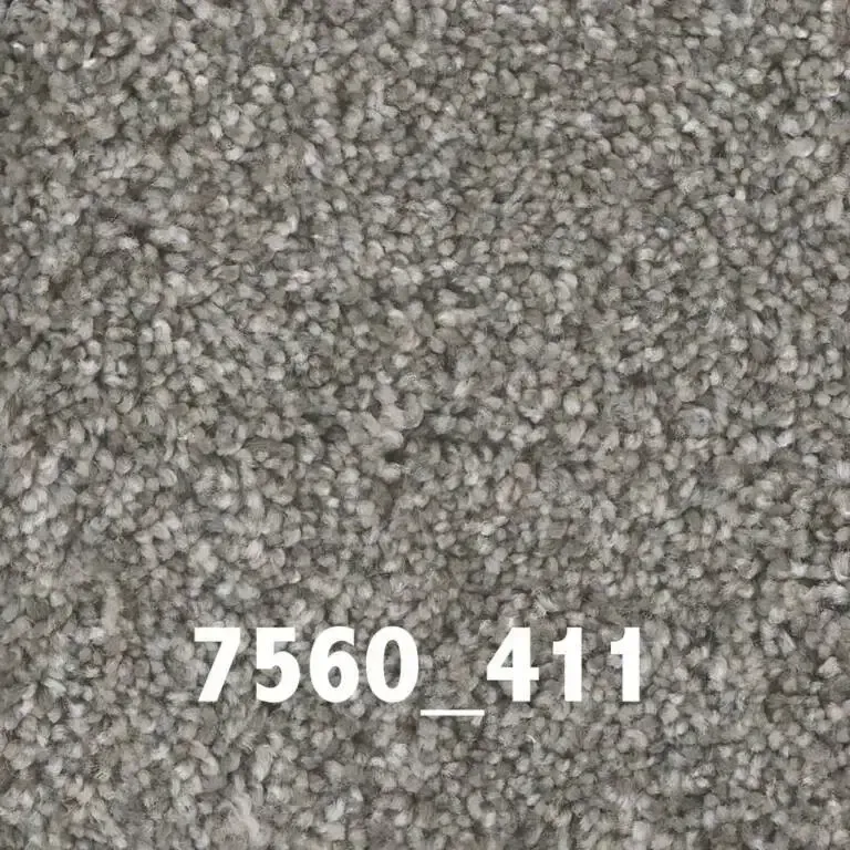 Close-up of gray-toned carpet with a textured surface; text 
