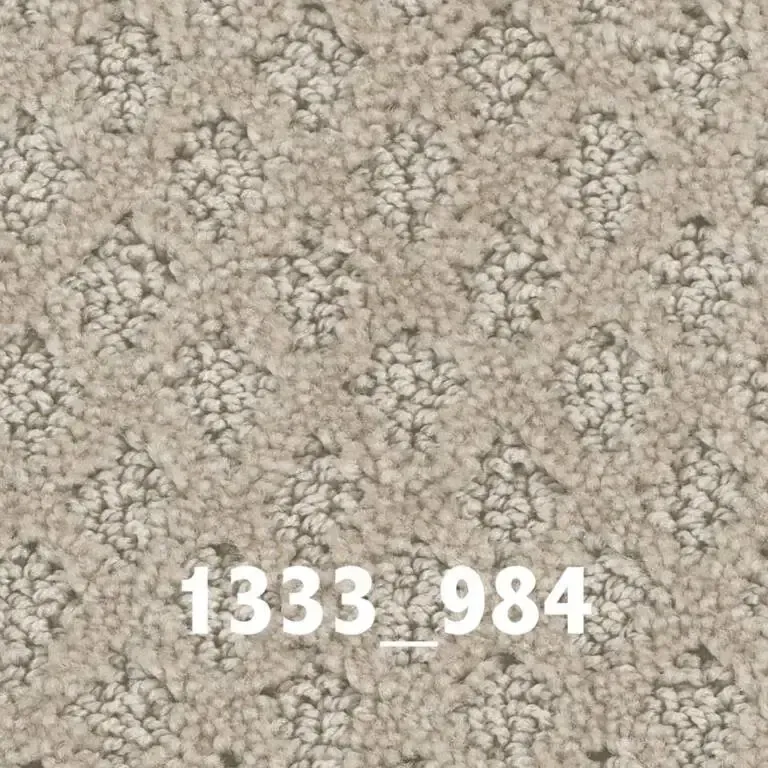 Beige carpet with a patterned, textured surface.