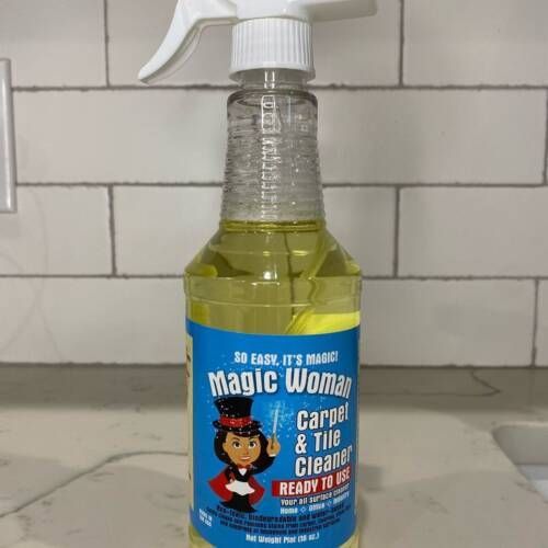 Bottle of Magic Woman Carpet & Tile Cleaner on a countertop.
