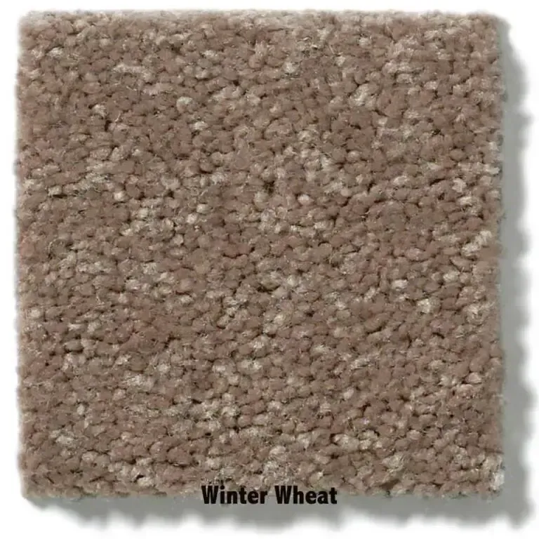 Square carpet sample, “Winter Wheat” color, featuring a flecked, low-pile texture in tan and cream.