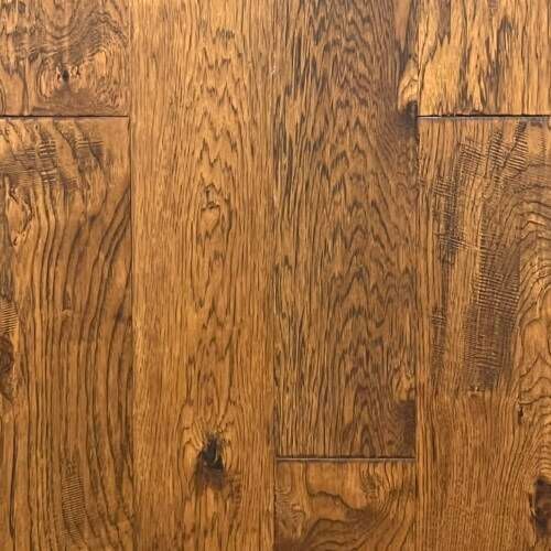 Close-up of a brown hardwood floor with visible wood grain and knots.